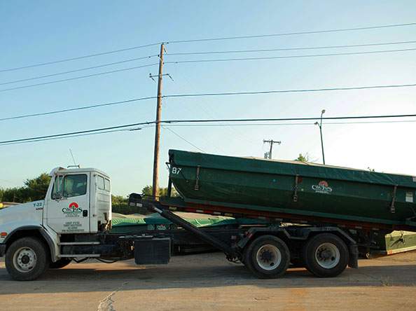 Cactus Environmental roll off truck with roll off container