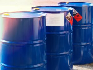 The close-up shot of blue color hazardous dangerous chemical drum barrels. Contact Cactus Environmental Services.